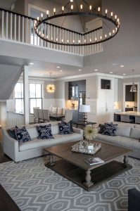 Living room with circular ceiling light in custom home built by Radiant Homes