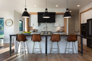 Leather chairs at custom Kitchen Island built by Fargo Home Builder Radiant Homes