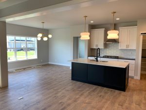 Custom kitchen with island and matte black faucet