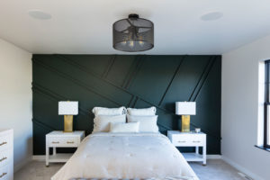 Dark Green accent wall in bedroom in Custom Home Fargo, ND