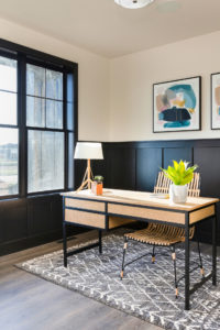 Oak desk with black steel in Black and cream office