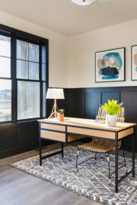 Oak desk with black steel in Black and cream office