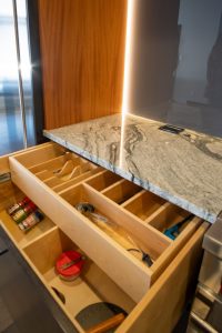 Custom Storage in Modern Kitchen with Granite Countertops