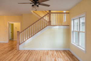 Oak Hardwood floors and custom staircase built by custom Home Builder