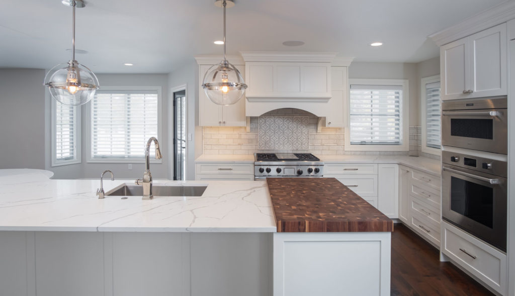 Custom granite kitchen counter top with butcher block end cap in Radiant Homes custom home