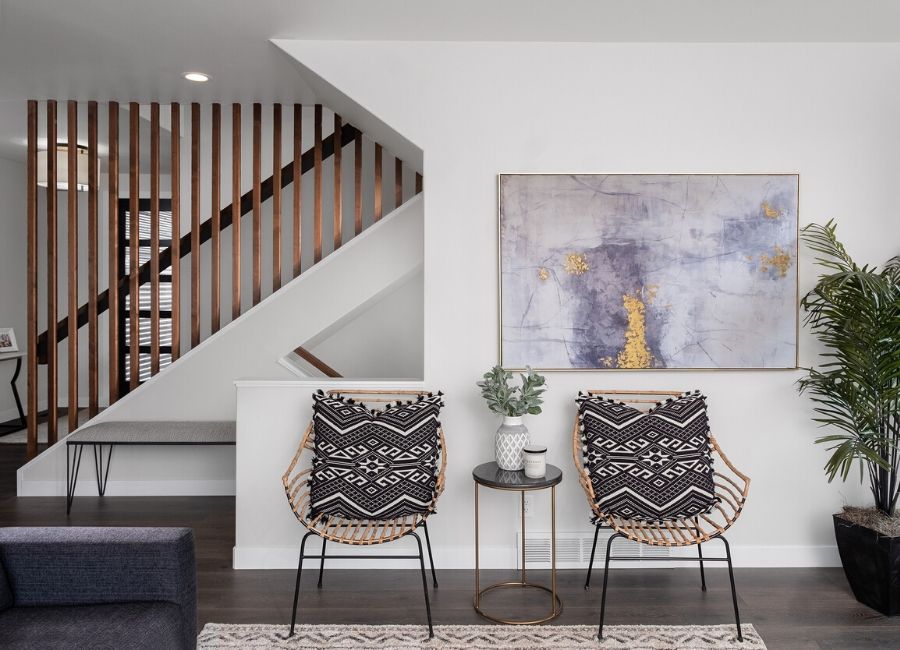 Wooden Spindle Staircase against white wall in Radiant Homes