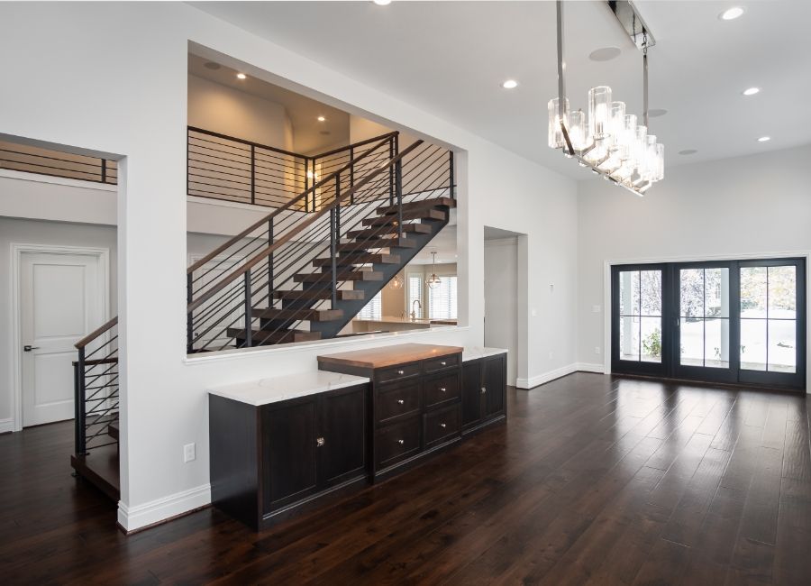 Remodeled Entryway with walnut staircase 