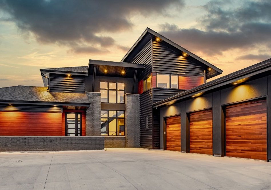 Striking Contemporary Home with three stall garage and peaked roof