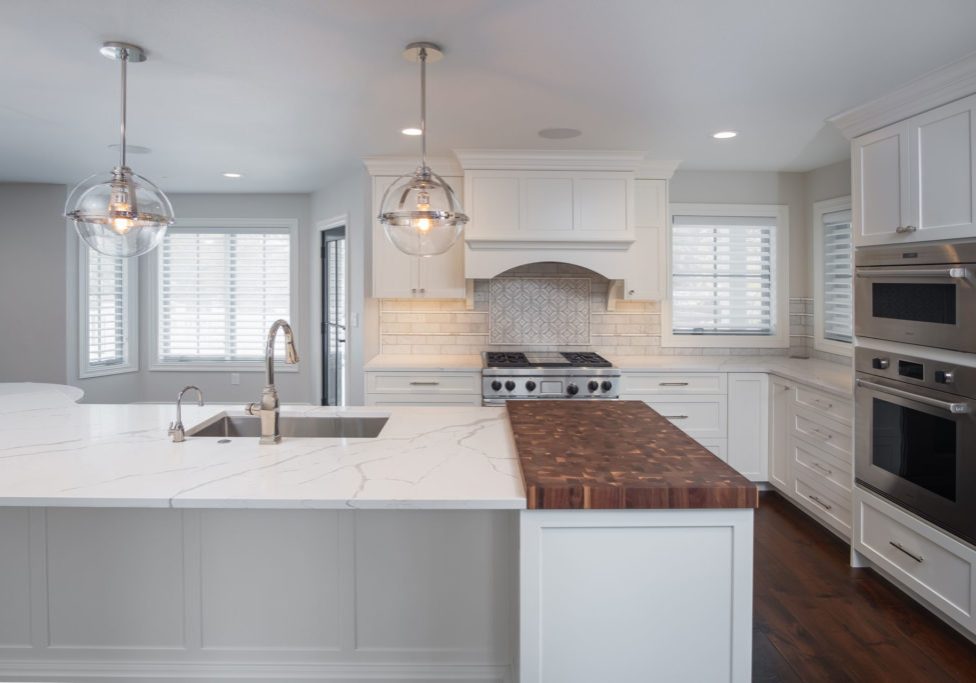 Custom granite kitchen counter top with butcher block end cap in Radiant Homes custom home